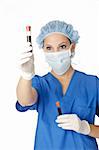 Beautiful laboratory technician examining a tube of blood