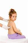 Little girl with small pox at the doctors examination - isolated healthcare concept