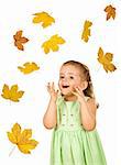 Surprised happy little girl with falling autumn leaves - isolated