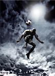 afrcican soccer player heading a ball in a stormy weather