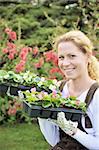 Young woman holding seedlings