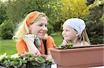 Mother and daughter having gardening time