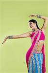 Brunette indian dancer princess Bollywood style, colorful sari