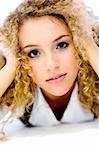 An attractive young woman with great curly hair on white background