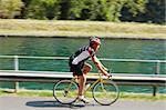 Senior bicyclist on road bike. Blurred background. Copy space