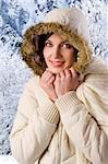 nice young woman with a white winter jacket with hood with fur on head