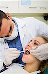 young male dentist at work