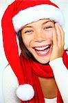 Christmas woman in a Santa hat very surprised and excited. Isolated on white background.