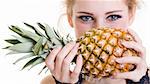 Close-up portrait of beautiful female with pineapple on white background