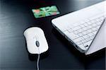 Notebook, credit card, mouse (shallow DOF)