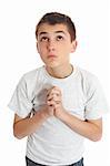 Boy with hands clasped in prayer looks to heaven God for answers