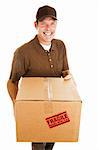 Friendly, smiling delivery man bringing a fragile package.  Isolated on white.