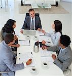 High angle of Multi-ethnic business people discussing in office a plan