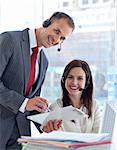 Manager working with a beautiful businesswoman in a call center