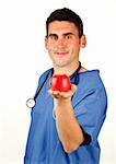 Young doctor showing a red apple