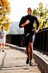 An African American jogging in a park in the morning