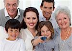 Portrait of family watching television at home