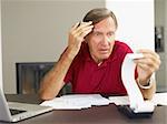 Senior man worried about his home finances. Copy space