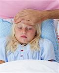Portrait of sick girl in bed having flu