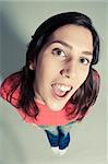 close-up of a cheerful young woman looking up top view,indoor