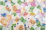 European currency banknotes scattered on the table, top view - background