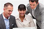 Businesswoman working with two colleagues in the office