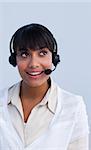 Beautiful ethnic young businesswoman working in a call center