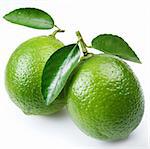 Lime with leaves on a white background