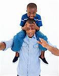 Dad giving son piggyback ride with closed eyes against white background