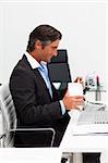 Businessman eating chinese food with chopstick in the office