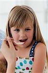 Close-up of little girl taking medecine in the hospital