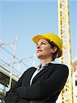 female engineer with arms folded looking away. Copy space