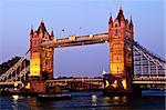 Tower bridge in London England at sunset over Thames river