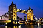 Tower bridge in London England at night over Thames river