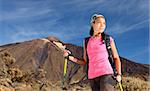 Female hiker. Young asian female model hiking / backpacking in very scenic and beautiful volcanic landscape on the volcano, Teide, Tenerife, Spain.