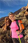 Woman hiking. Young asian female model hiking / backpacking in beautiful volcanic landscape on the volcano, Teide, Tenerife, Spain.