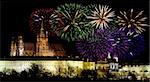 Prague castle in the night - residence of czech president and colorful fireworks during the New Year celebrations