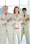 Business team with folded arms standing in a line