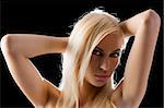 sensual portrait of beautiful blond woman with a fashion make up looking sexy in camera