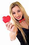 Woman holding Valentines Day heart sign with copy space