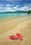 Beautiful beach landscape with flip-flops in Thailand