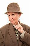 Senior woman in male tweed jacket and hat