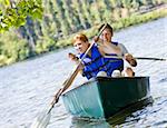 Couple rowing boat