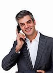 Mature businessman on phone looking at the camera