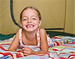 Girl laying in tent