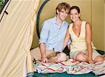 Couple sitting in tent