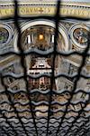 Altar in St Peter's Basilica seen through fencing. Vertical shot.
