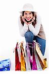 Young woman display all her shopping bags indoor studio