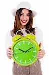 Beautiful young model with hat and showing clock on isolated white background