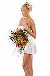 pretty young girl woth flowers and a bouquet in white short dress as spring season